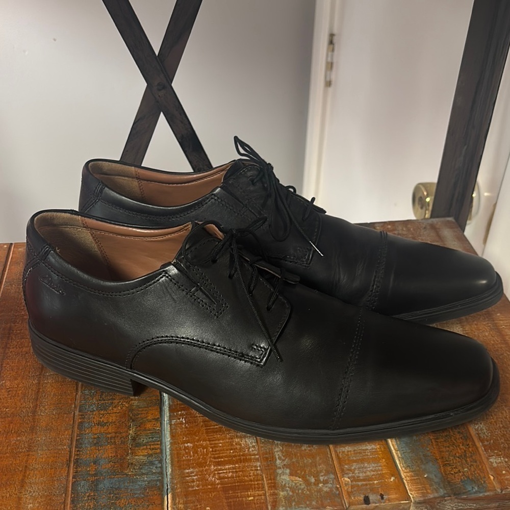 Clarks Black Slip-On Loafers with Polished Finish